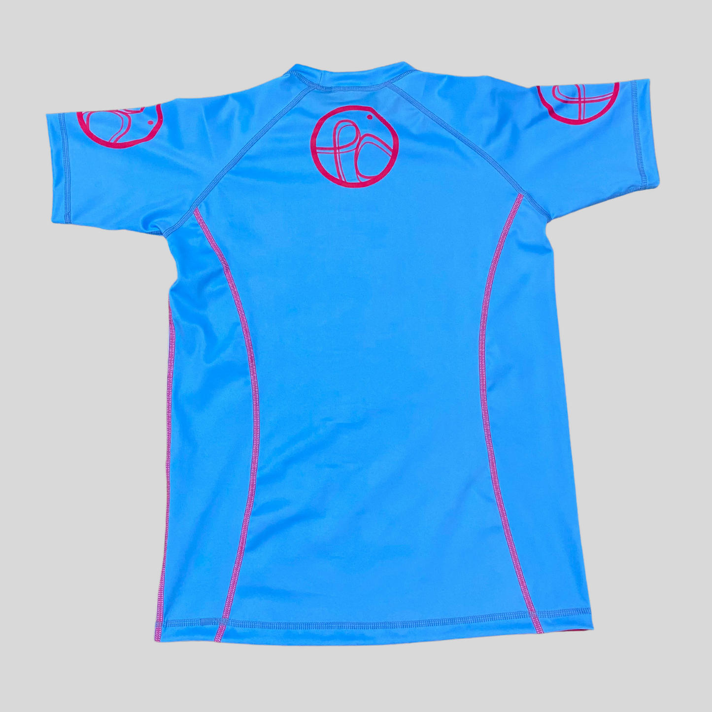 Blue with pink back picture rashguard featuring a sleek jaguar pattern, tailored for grapplers."