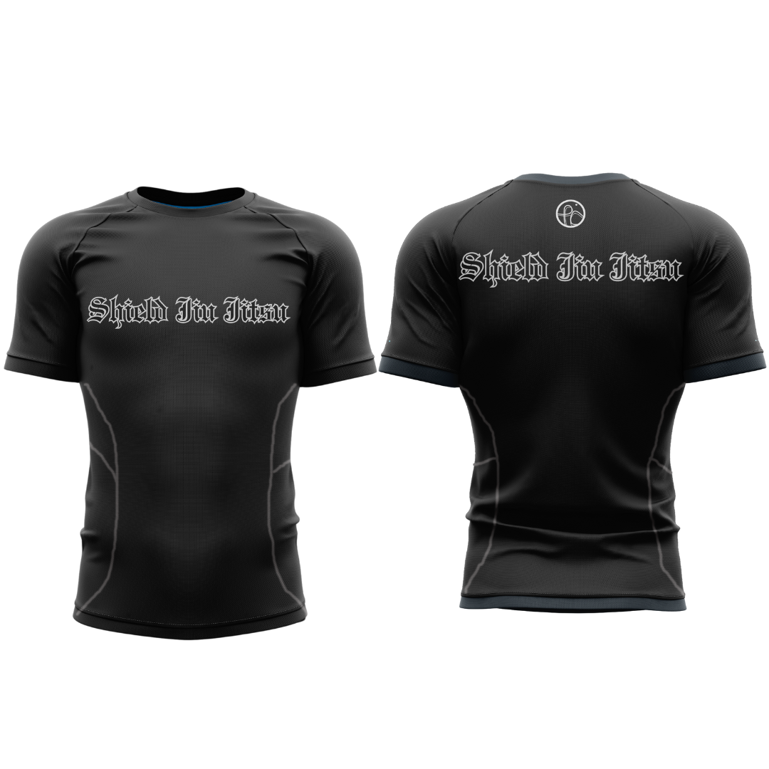 Black athletic shirt with 'Shield Fit Fit' branding on a white background