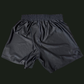 Black athletic shorts on a black background