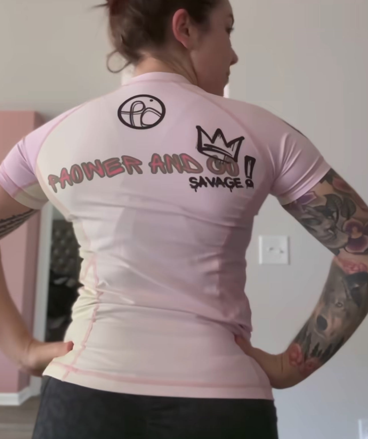 back view of queen P rashguard, pink with pink stitching