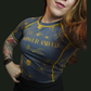Person wearing a blue and yellow patterned rashguard  with 'Paower and co" logo on the front. 
