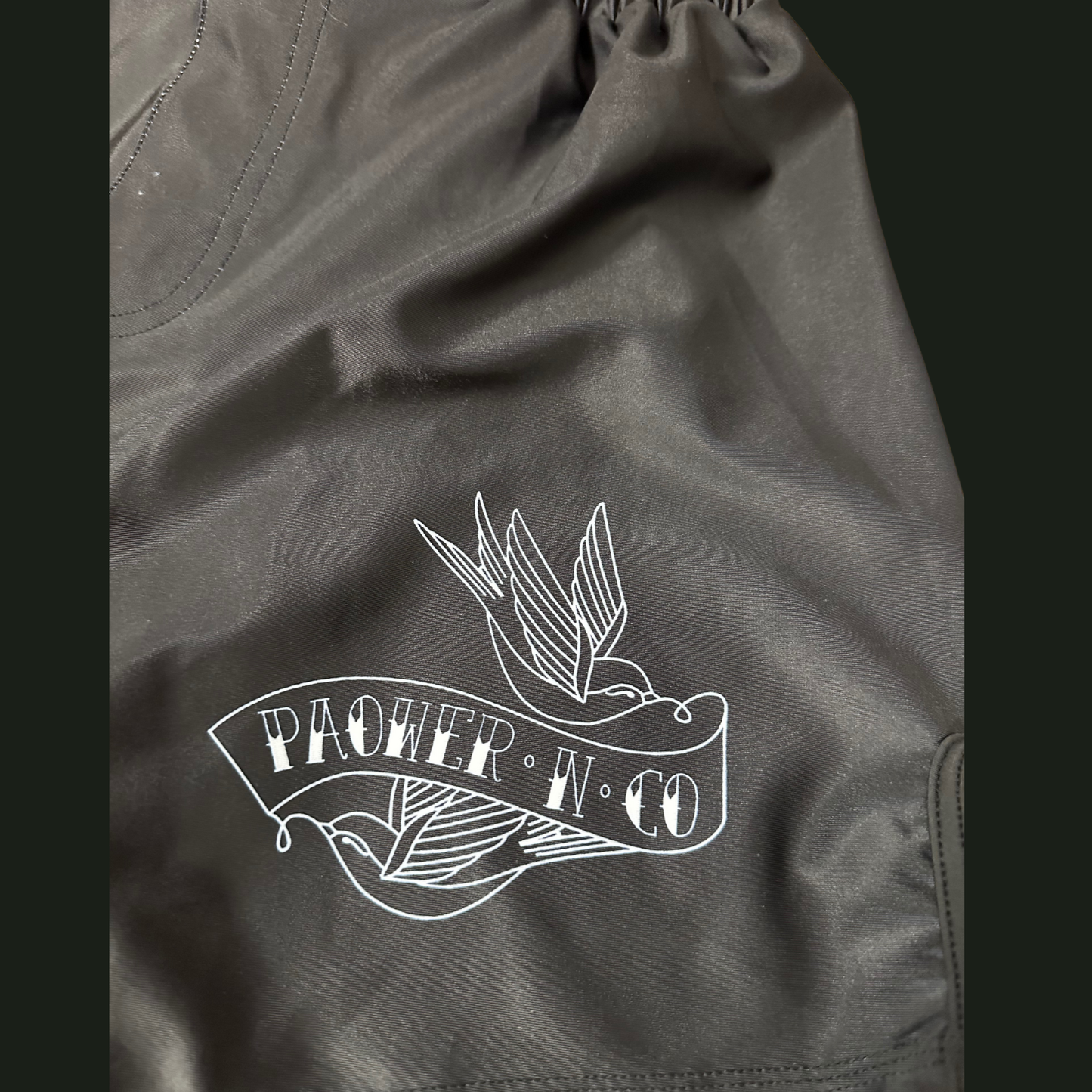 paower and co logo on the shorts