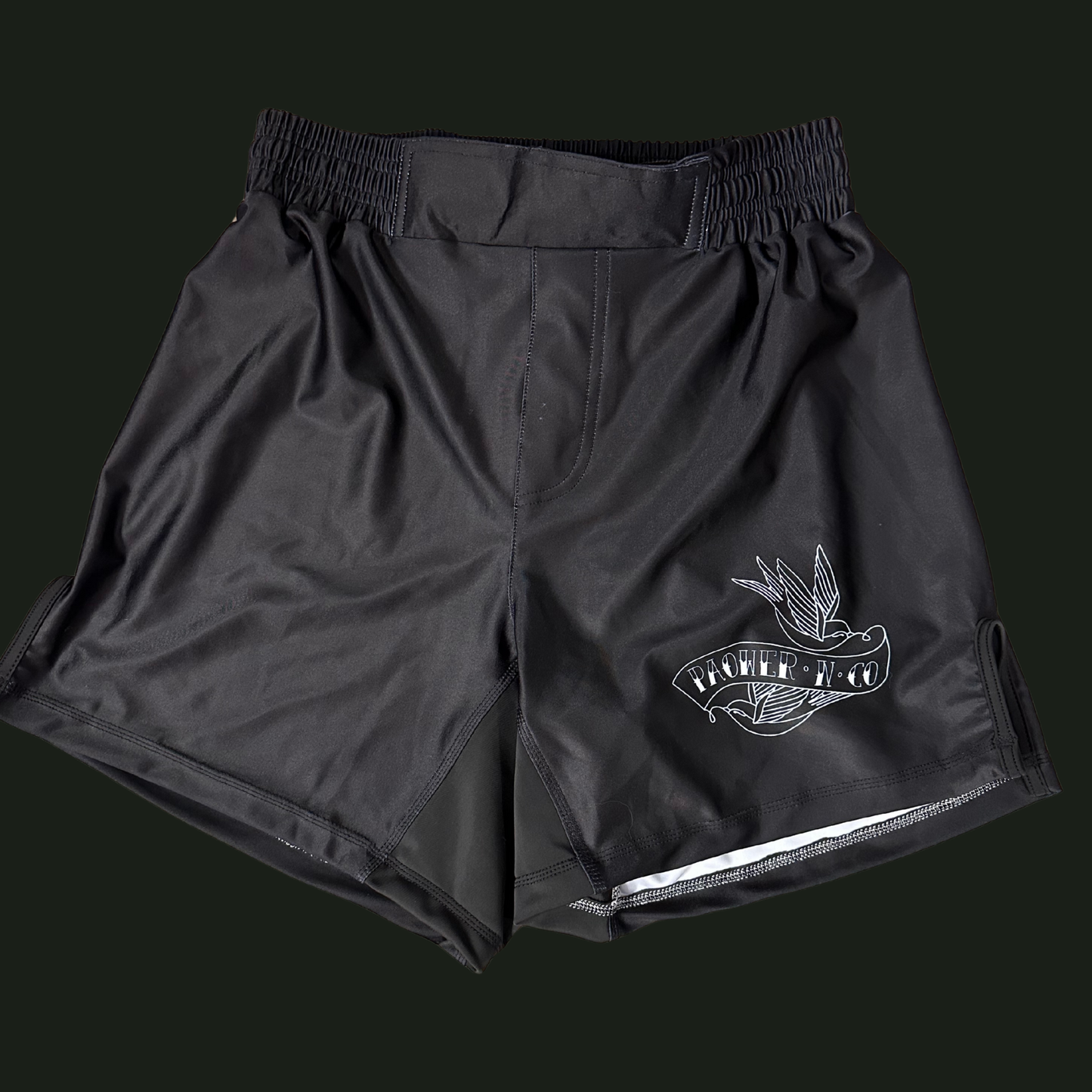 Black shorts with a logo on a black background